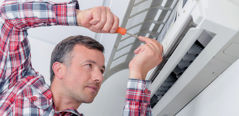 Repairing an air-conditioner.